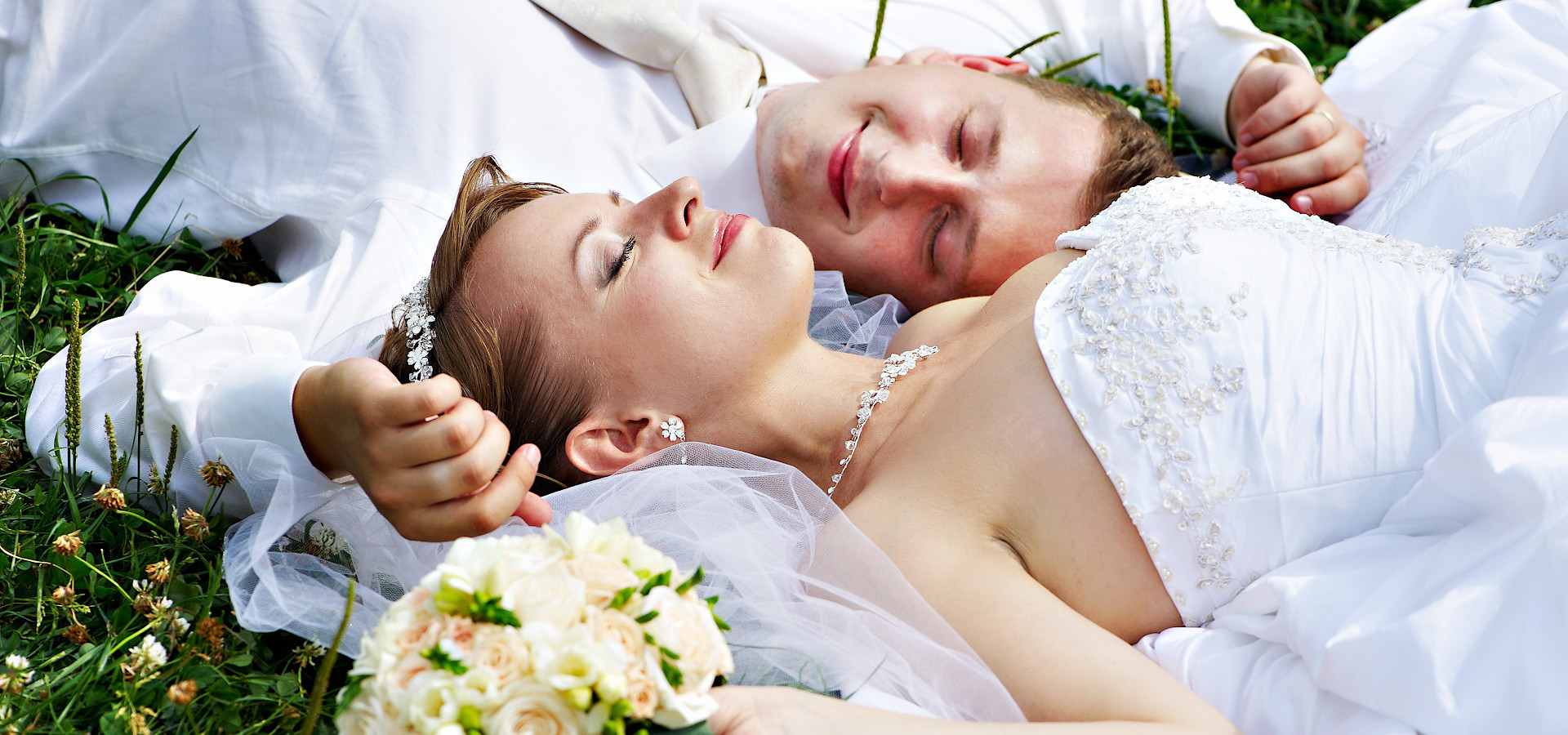 Wedding Couple lying on the grass